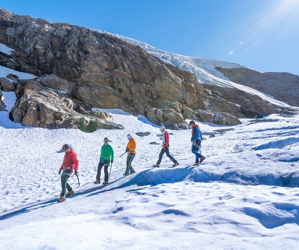 Mountaineers with crampons on the glacier
