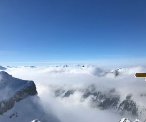 View from the summit of Gemmenalphorn on sea of fog and snow-covered mountains