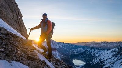 Mountain guide on the Oberaarhorn with sunrise in the background