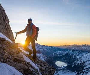 Mountain guide on the Oberaarhorn with sunrise in the background