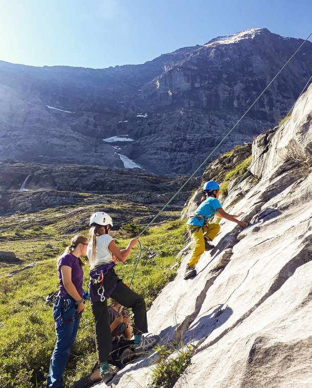 Children climbing and belaying