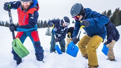 People practice avalanche rescue.