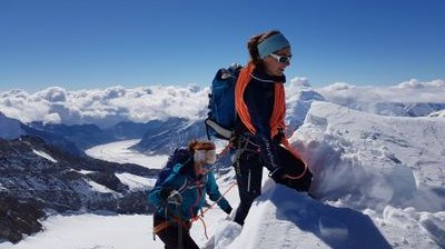 Mountaineers reach the summit of the Mönch.