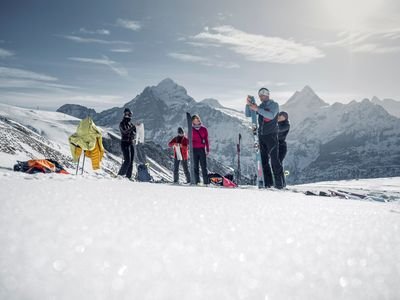 Ski tourers attach the skins to the skis.