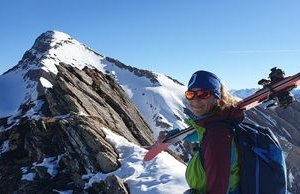 Ski tourers on a ridge with Schwarzhorn in the background.